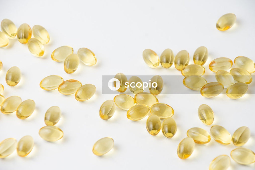 White and yellow round medication pills