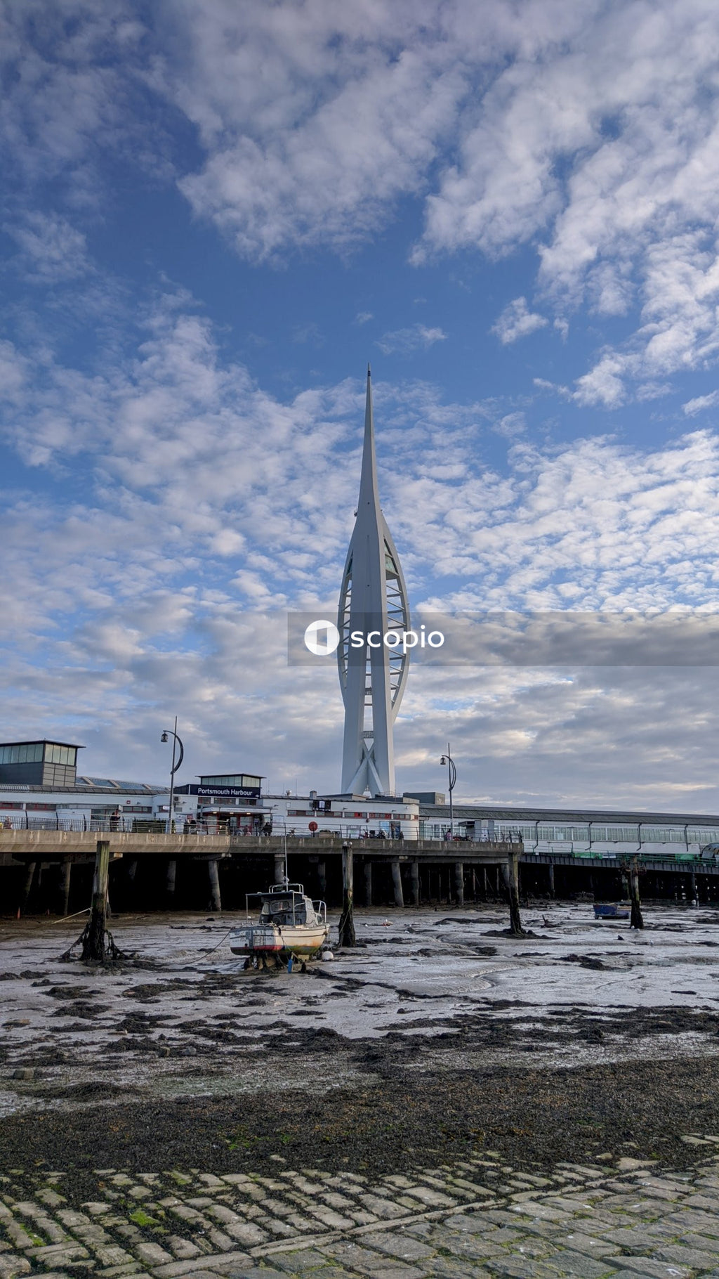 White boat on sea dock under blue sky