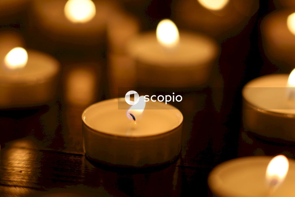 White candle on brown wooden table
