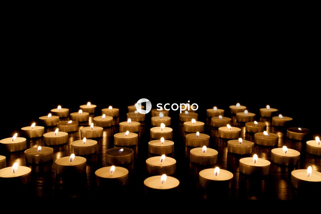White candles on black surface