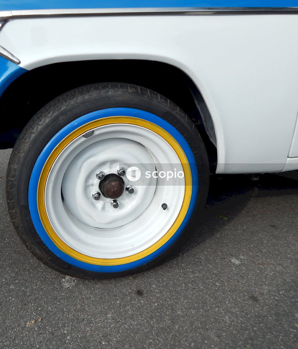 White car with blue and white wheel