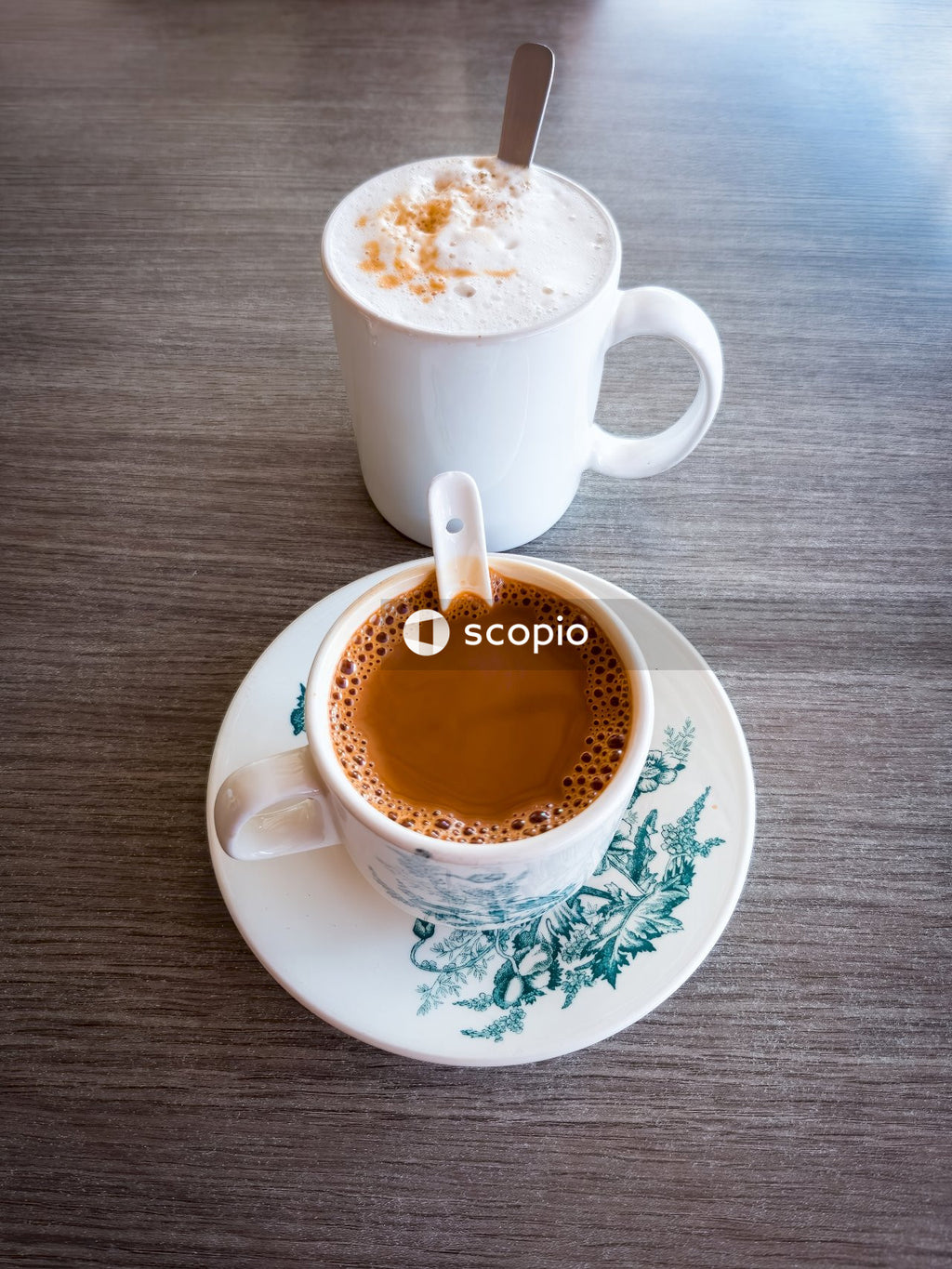 White ceramic cup with brown liquid