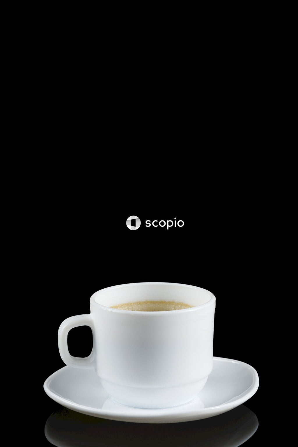 White ceramic mug on white ceramic saucer