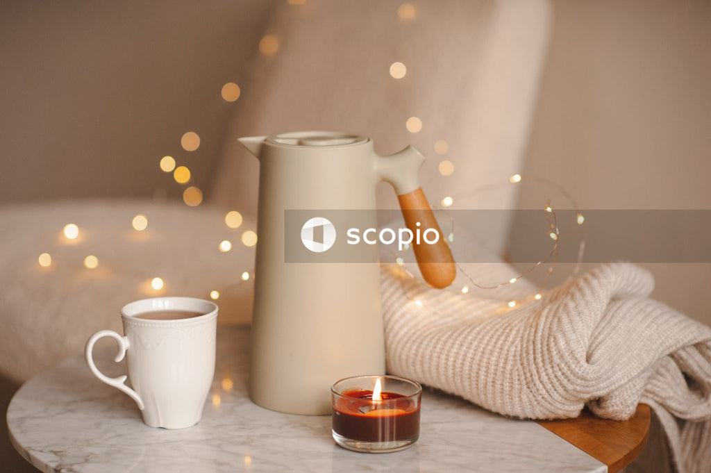 White ceramic pitcher beside clear drinking glass