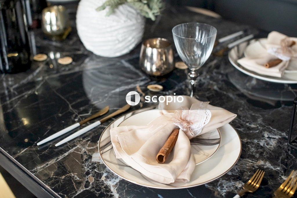White ceramic plate with bread knife and fork