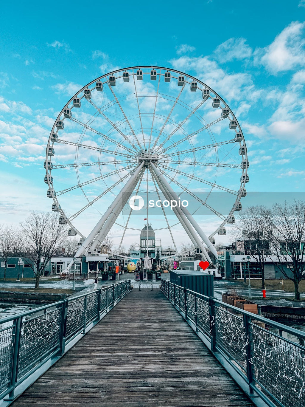 White ferris wheel under blue sky