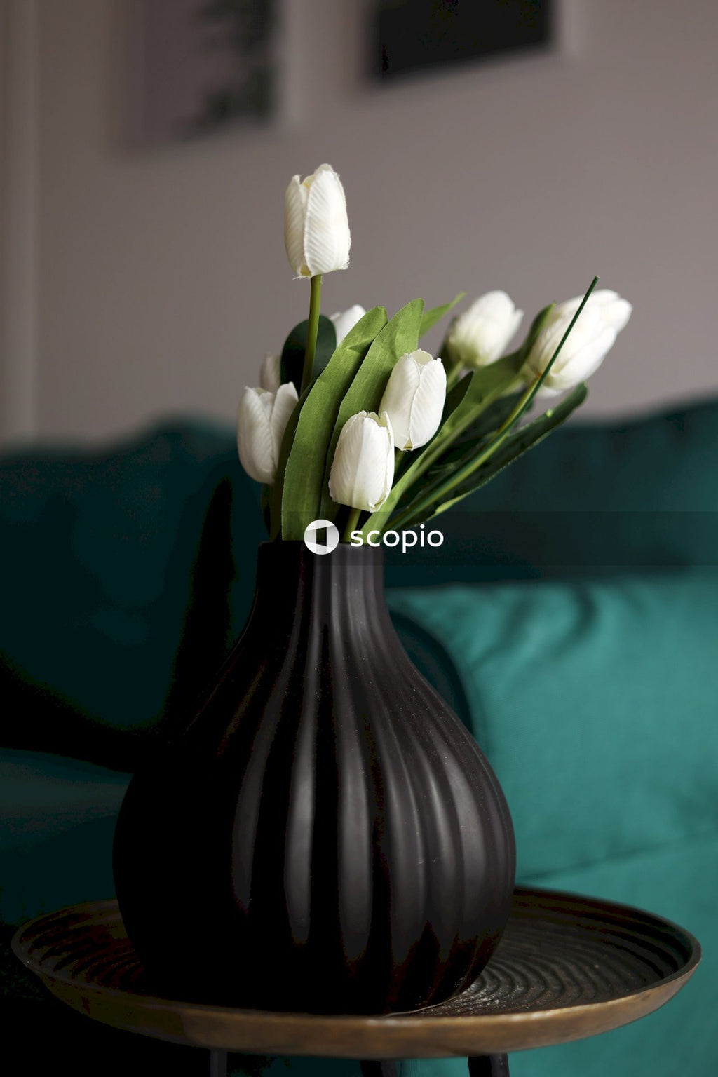 White flower on black ceramic vase