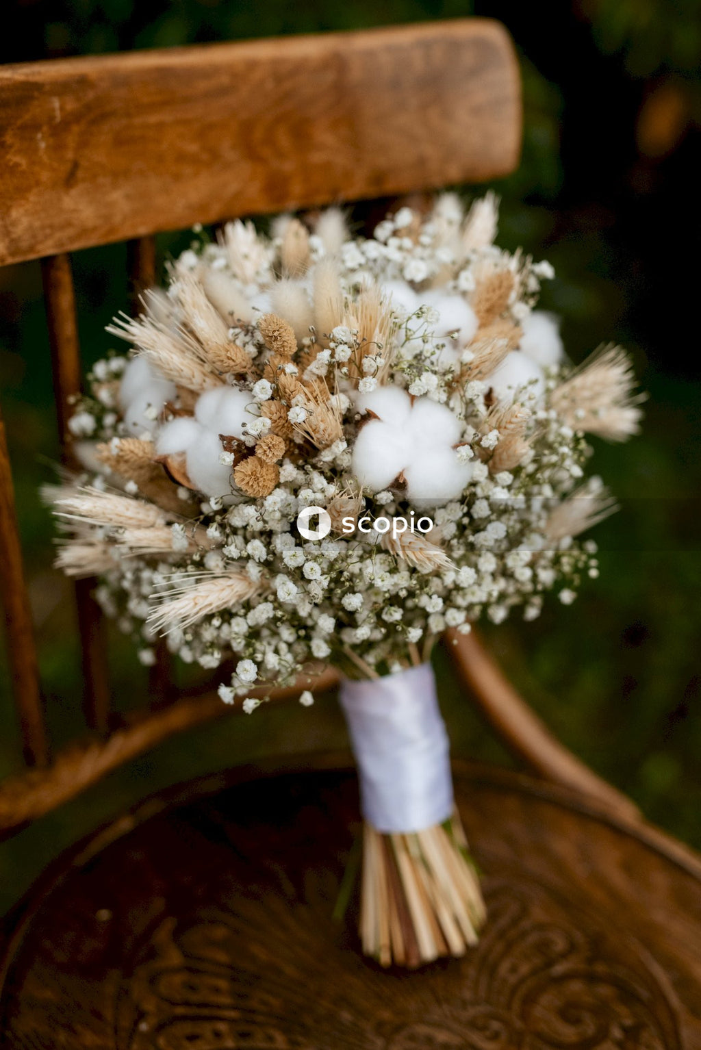 White flowers on brown wooden table