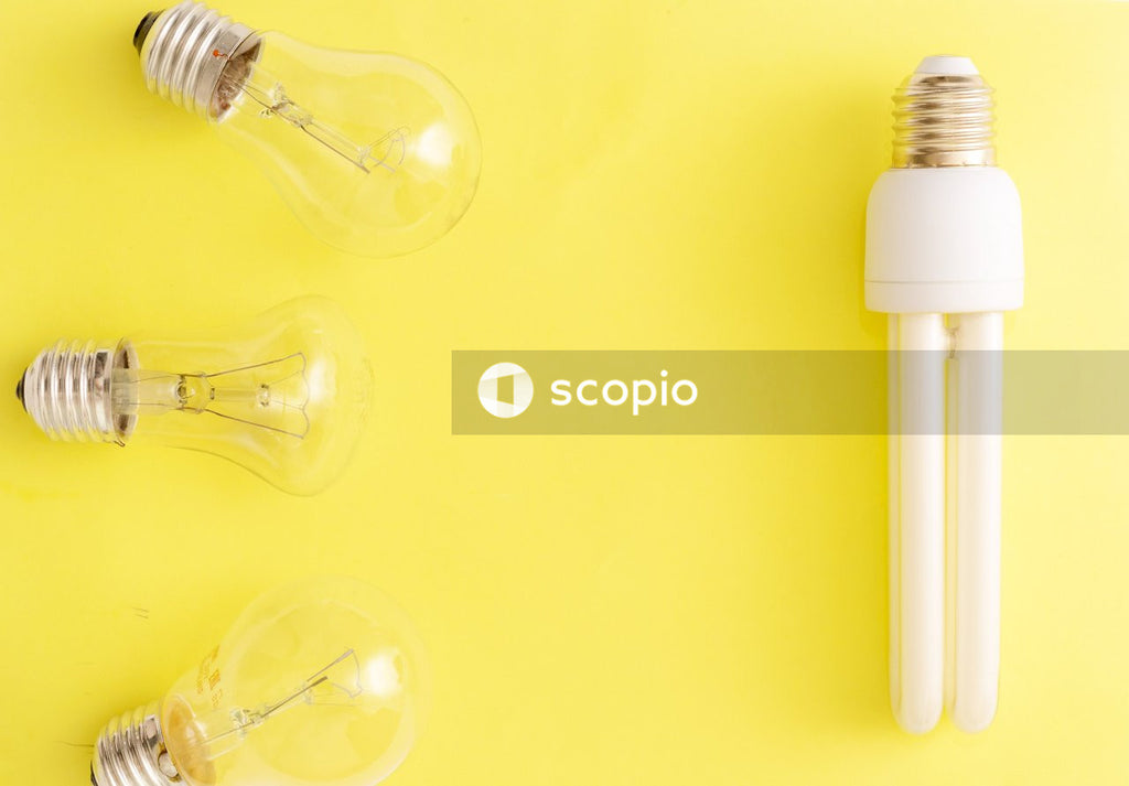 White light bulb on yellow surface