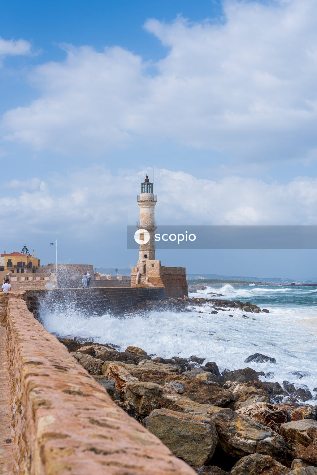White lighthouse near body of water