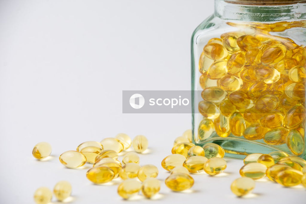 White medication tablets on clear glass jar