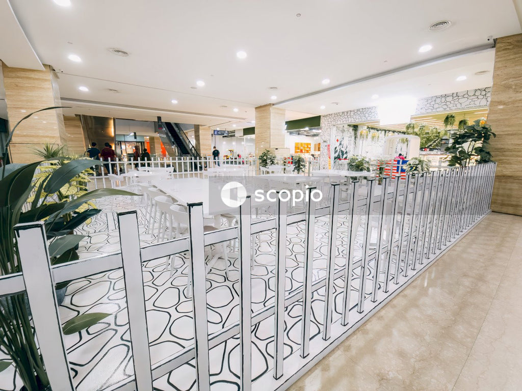 White metal fence near white concrete building