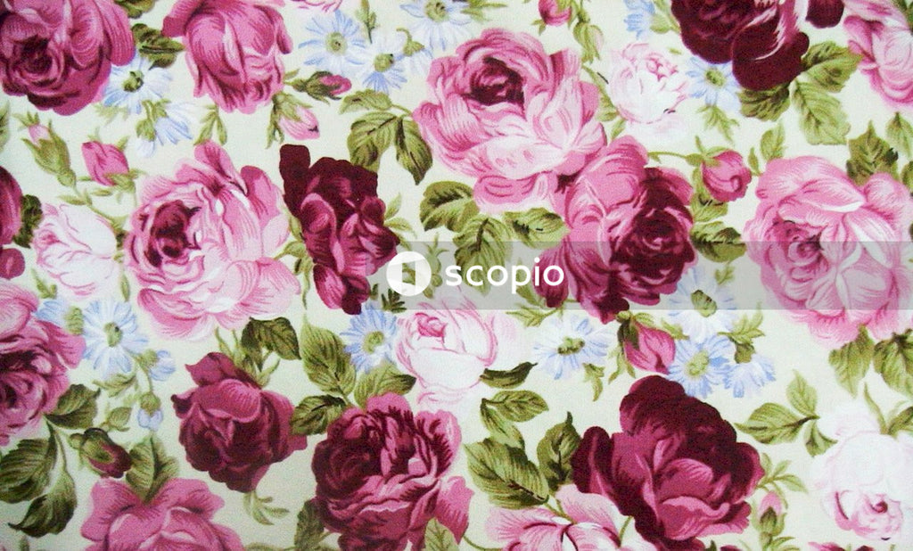 White pink and green floral textile