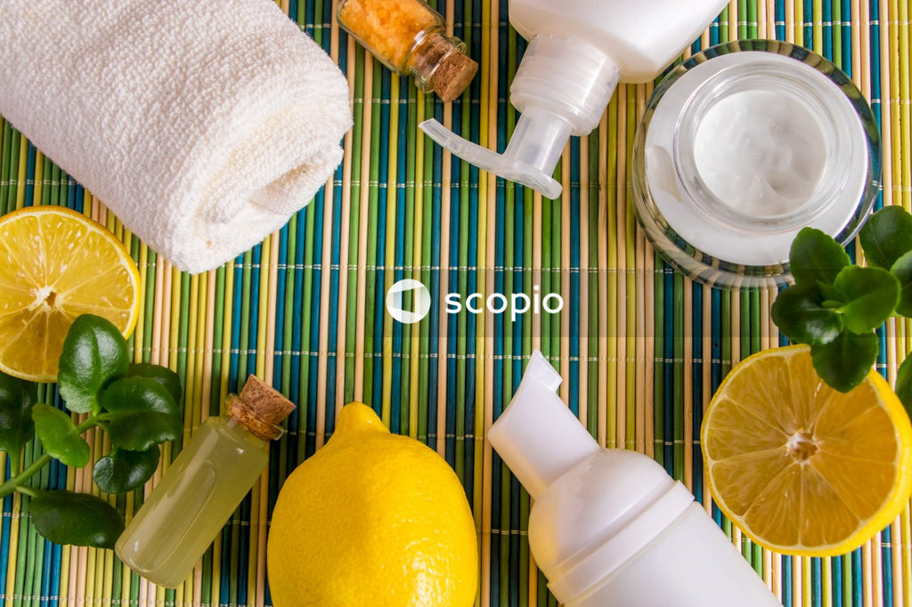 White plastic bottle beside yellow lemon fruit