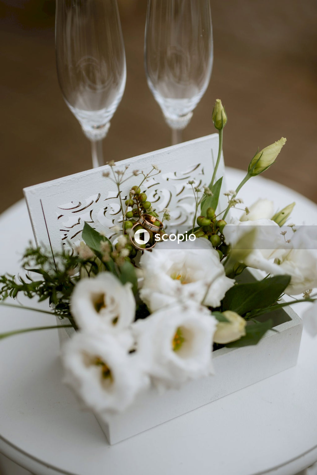 White roses bouquet on white ceramic plate