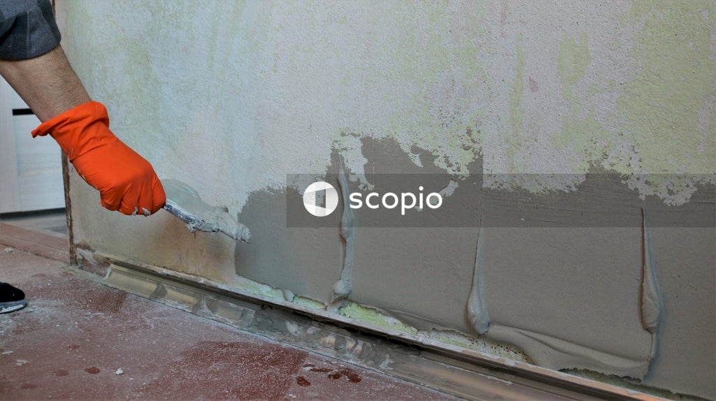 White wall paint near brown wooden door