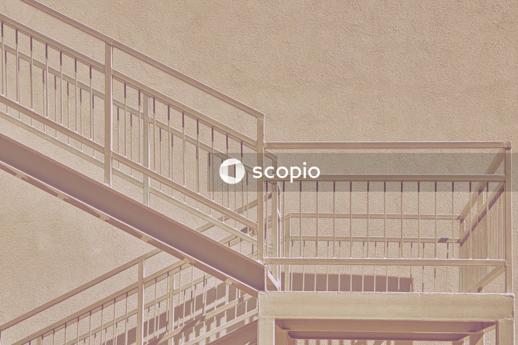 White wooden staircase on brown carpet