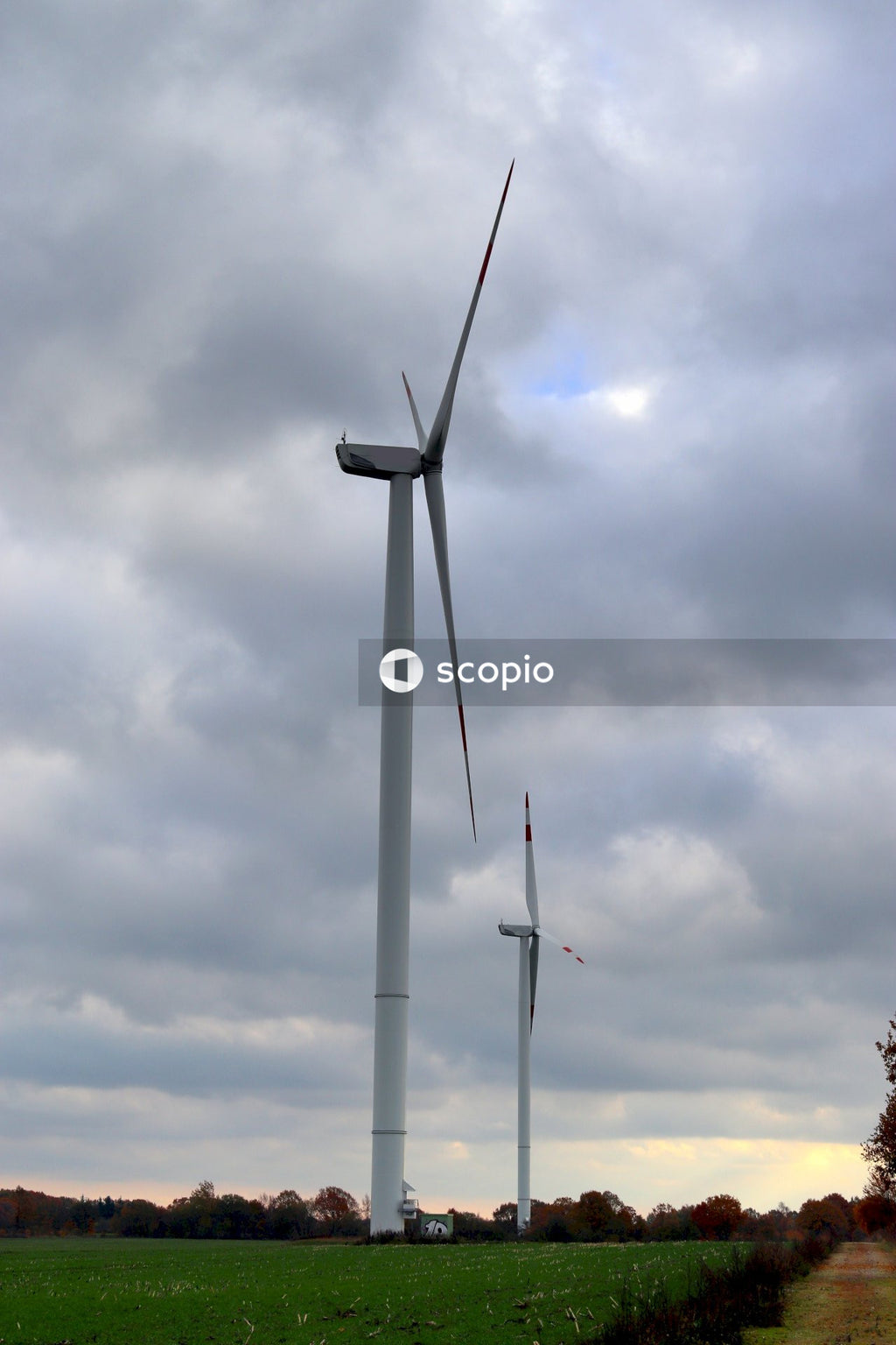 Wind turbine under white clouds
