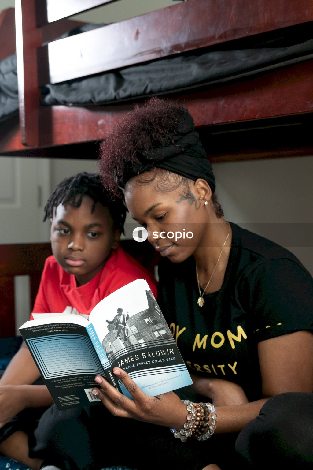 Woman and kid reading a book