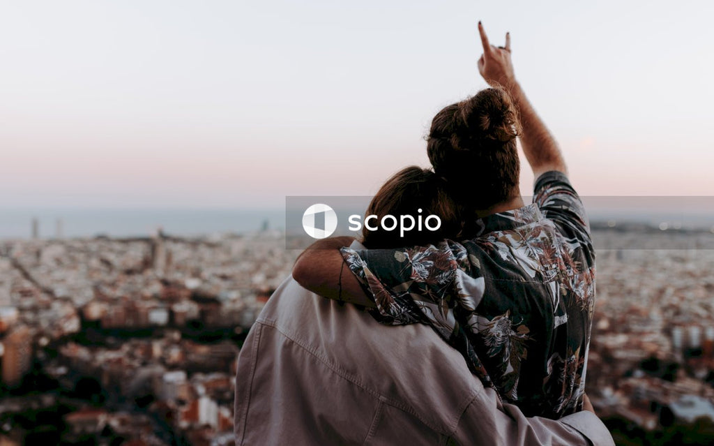 Woman and man hugging in front of view