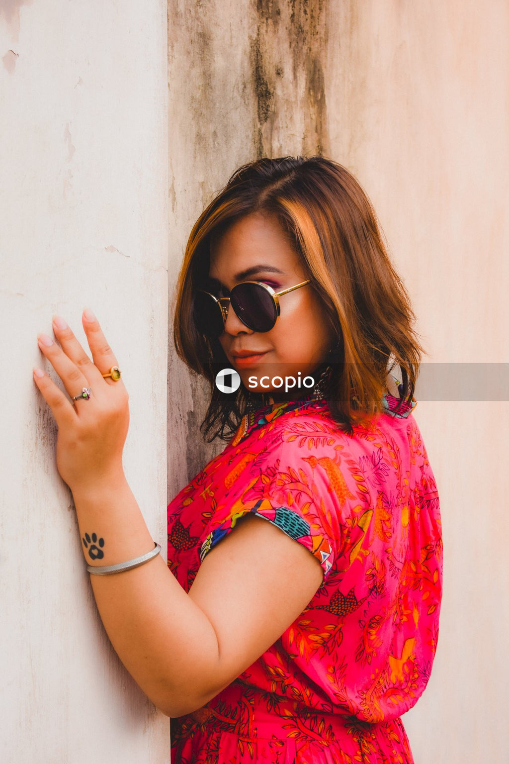 Woman hugging wall