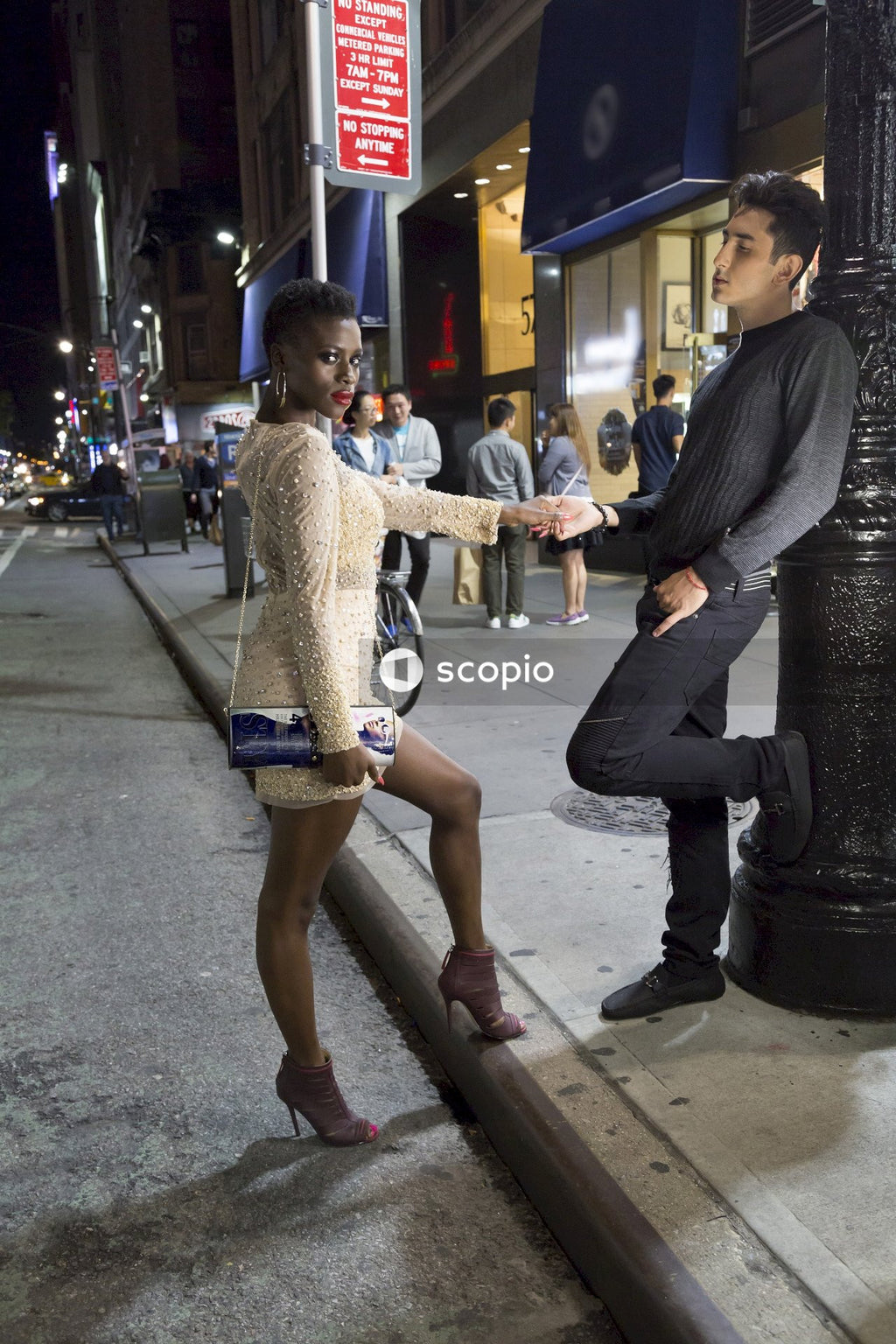 Couple on a date posing on street