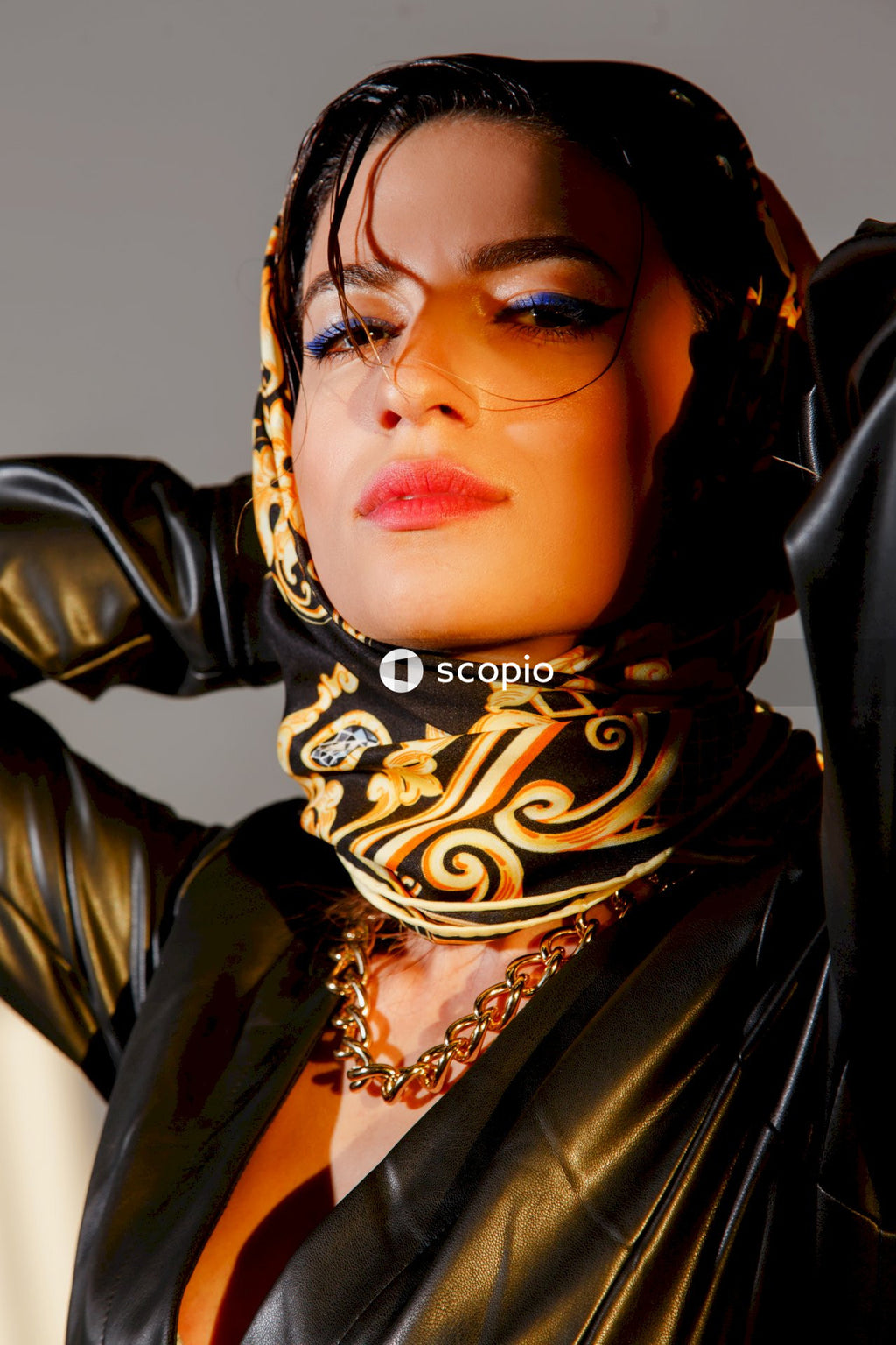 Woman in black and brown hijab