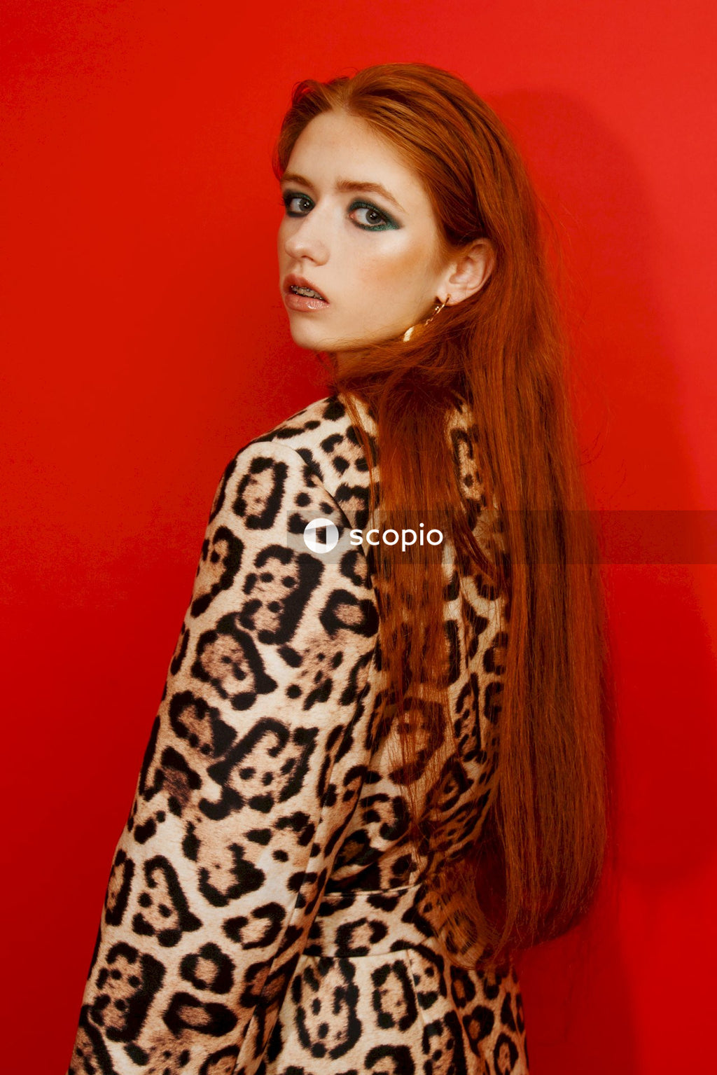 Woman in black and brown leopard print long sleeve shirt
