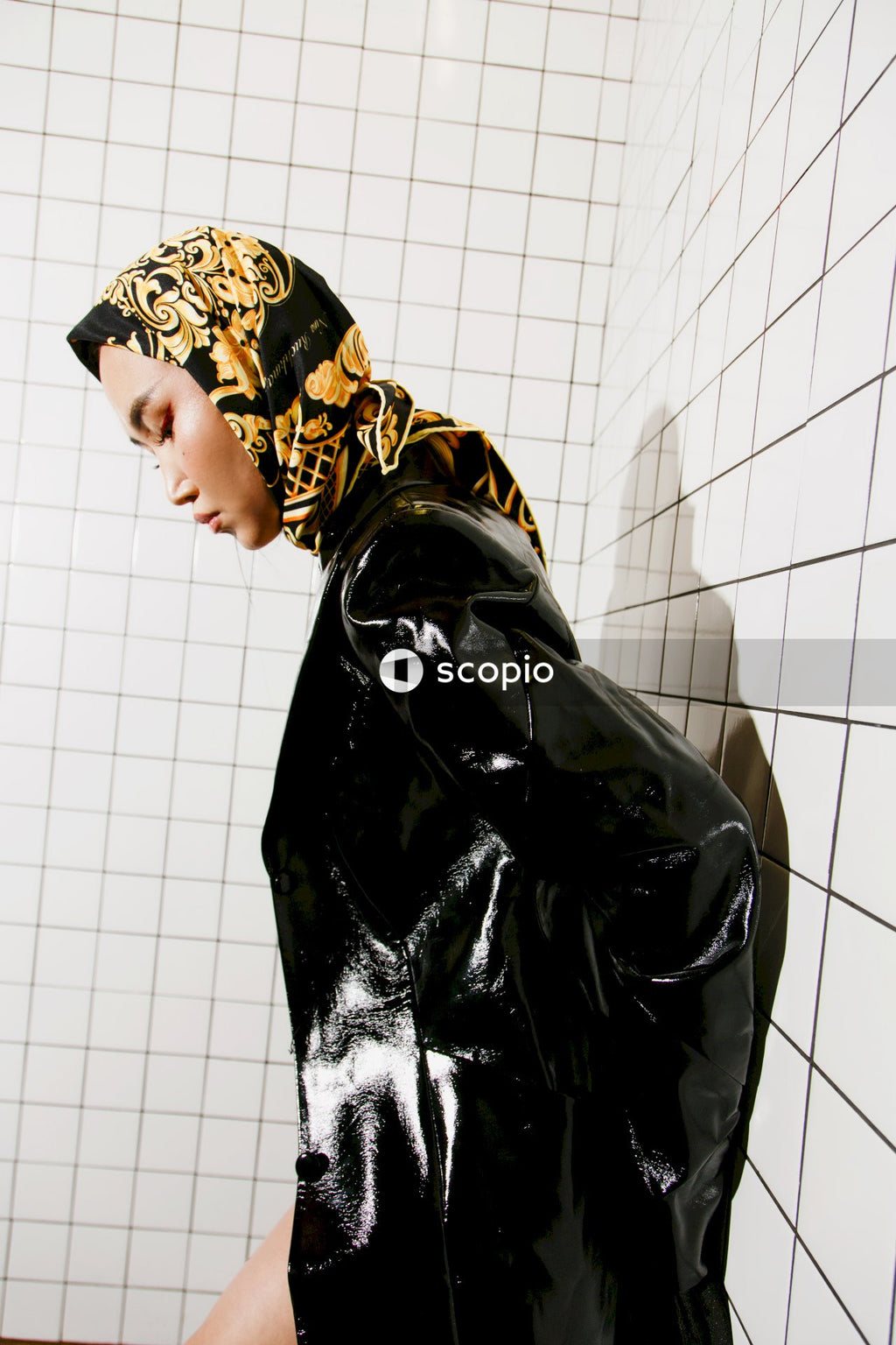 Woman in black and gold floral hijab