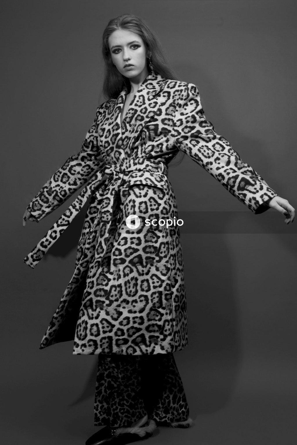 Woman in black and white floral long sleeve dress
