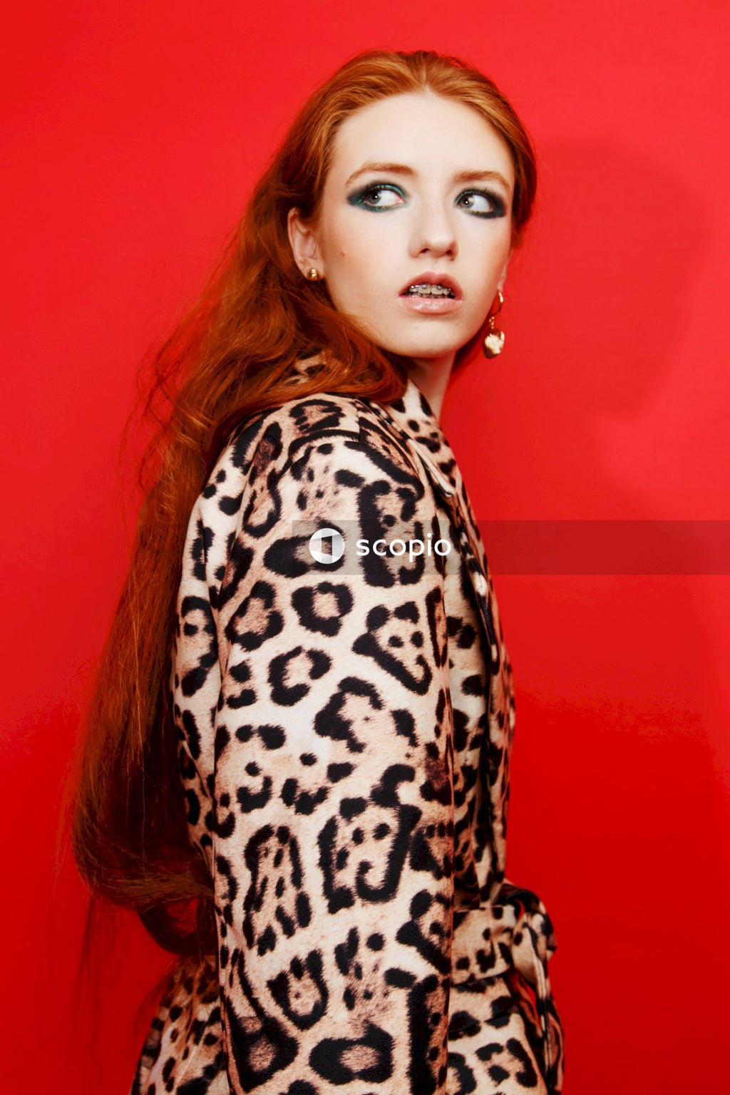 Woman in black and white leopard print long sleeve shirt