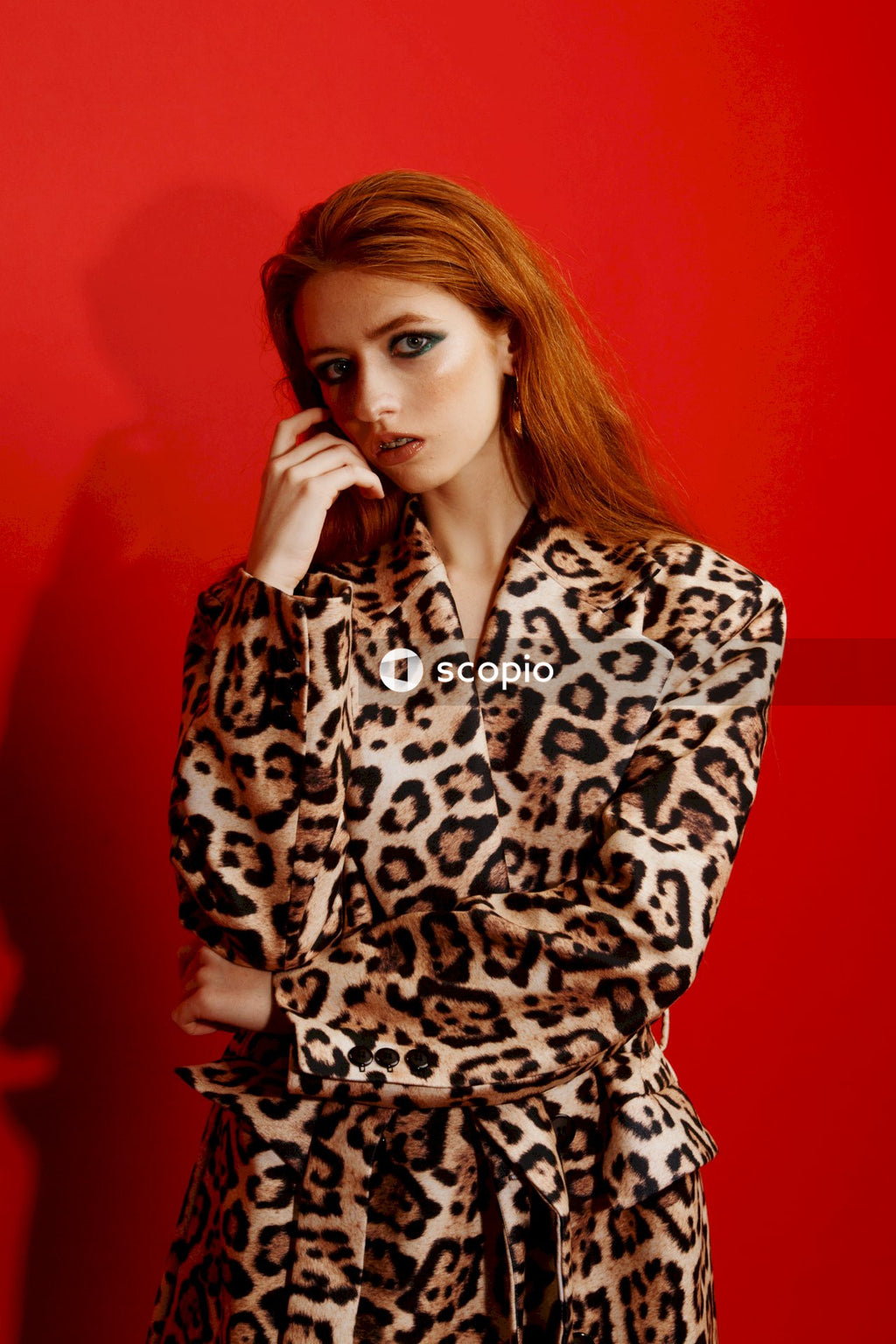 Woman in black and white leopard print long sleeve shirt