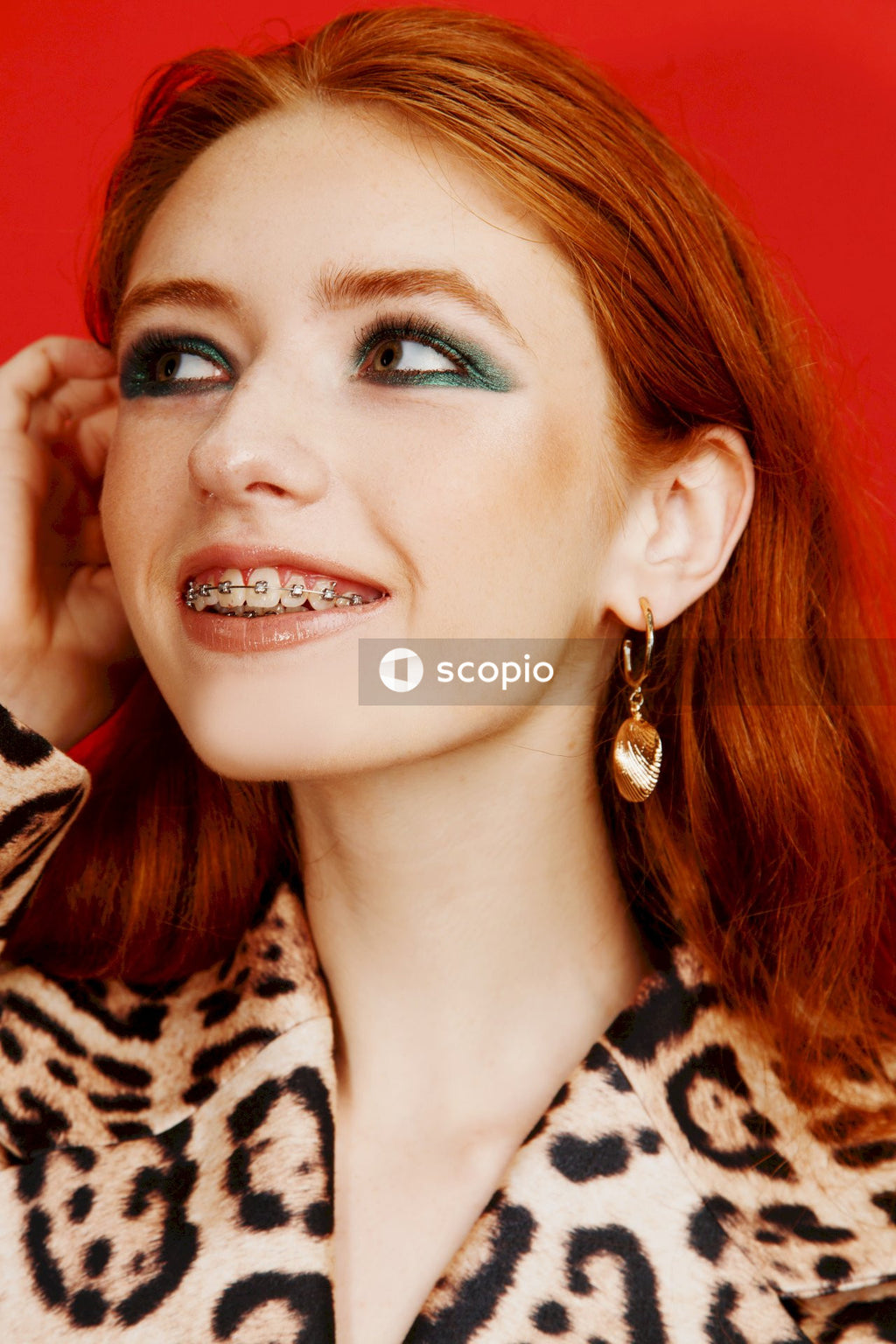 Woman in black and white leopard print shirt
