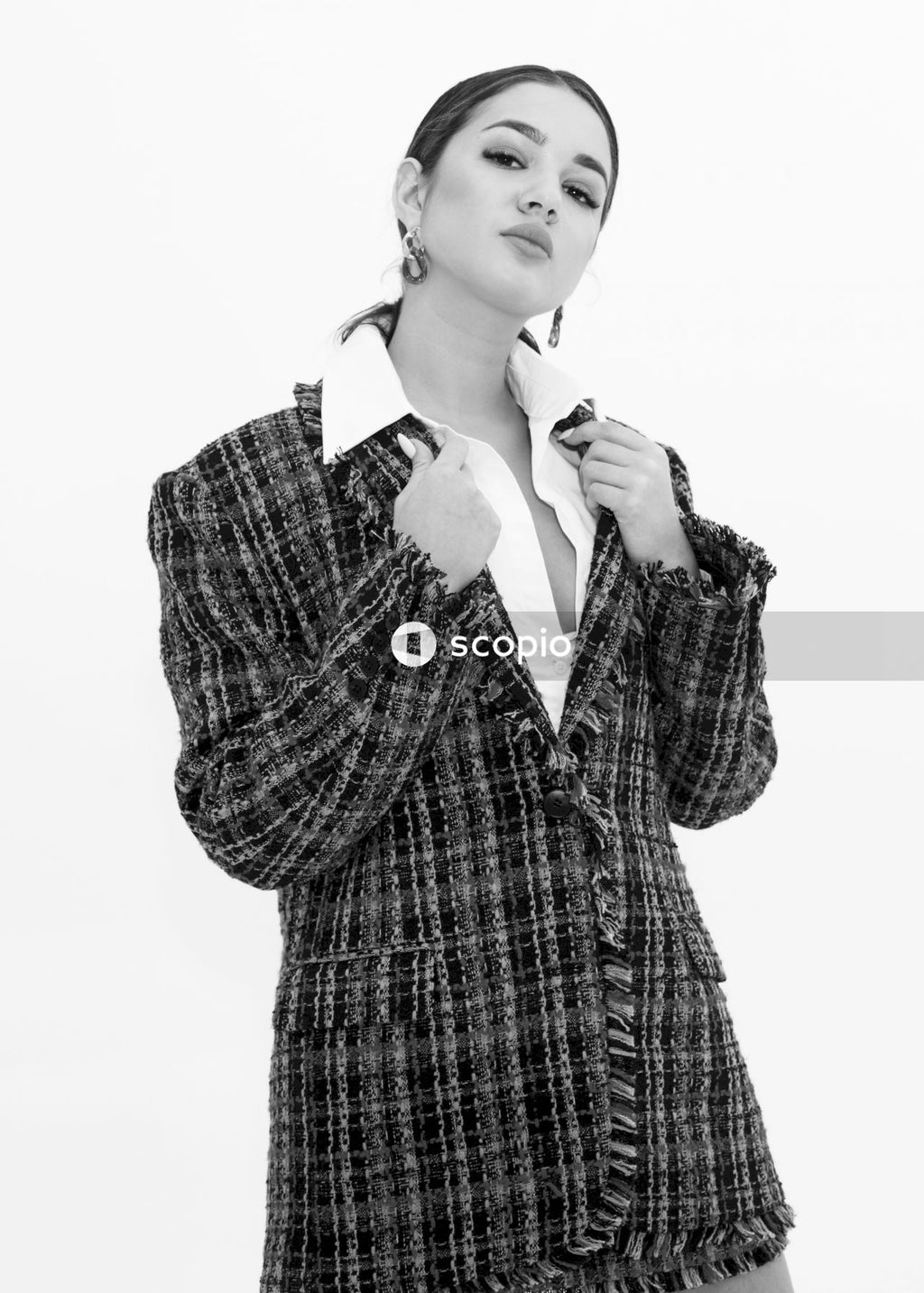 Woman in black and white plaid coat