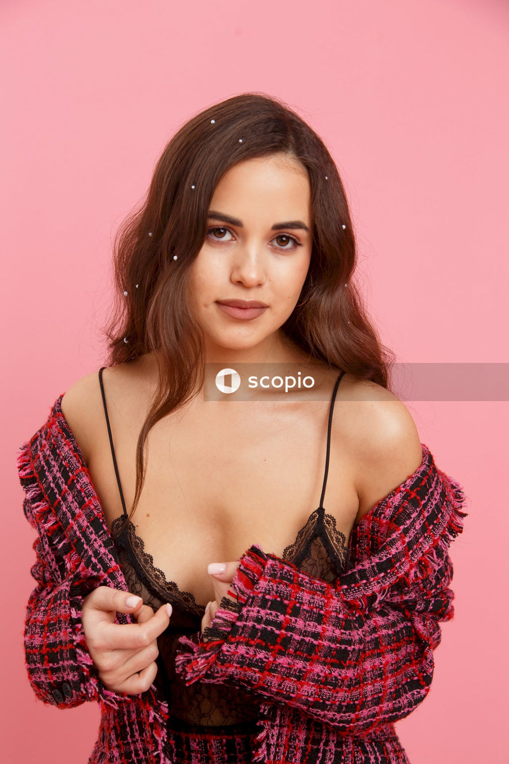 Woman in black and white plaid off shoulder top
