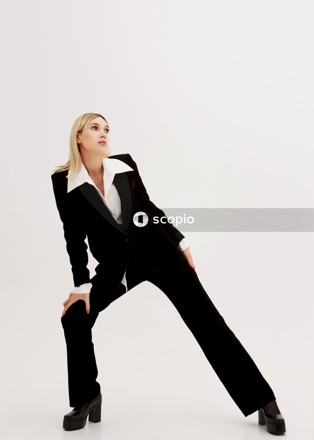 Woman in black blazer and black pants