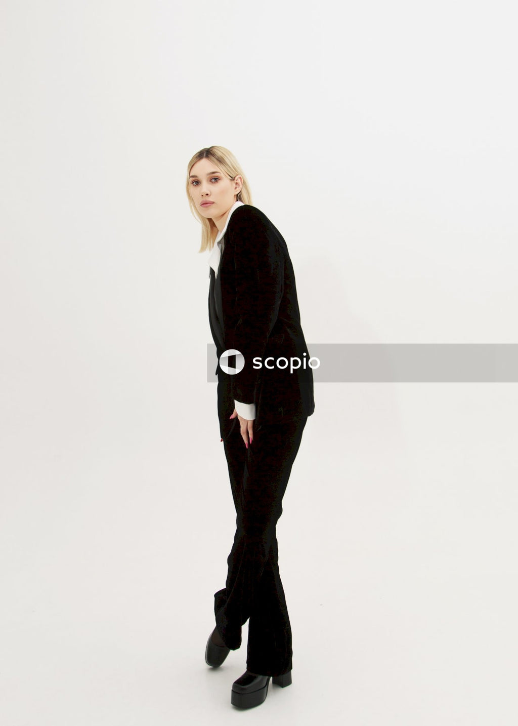 Woman in black blazer and black pants