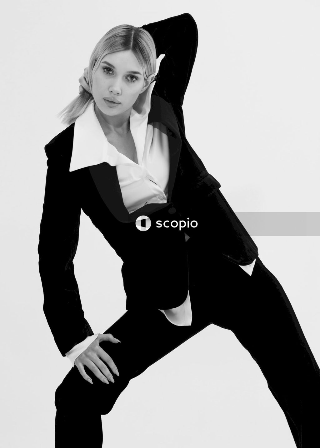 Woman in black blazer and black pants