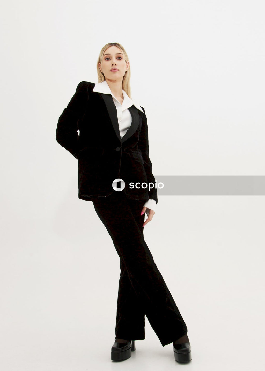 Woman in black blazer and black pants