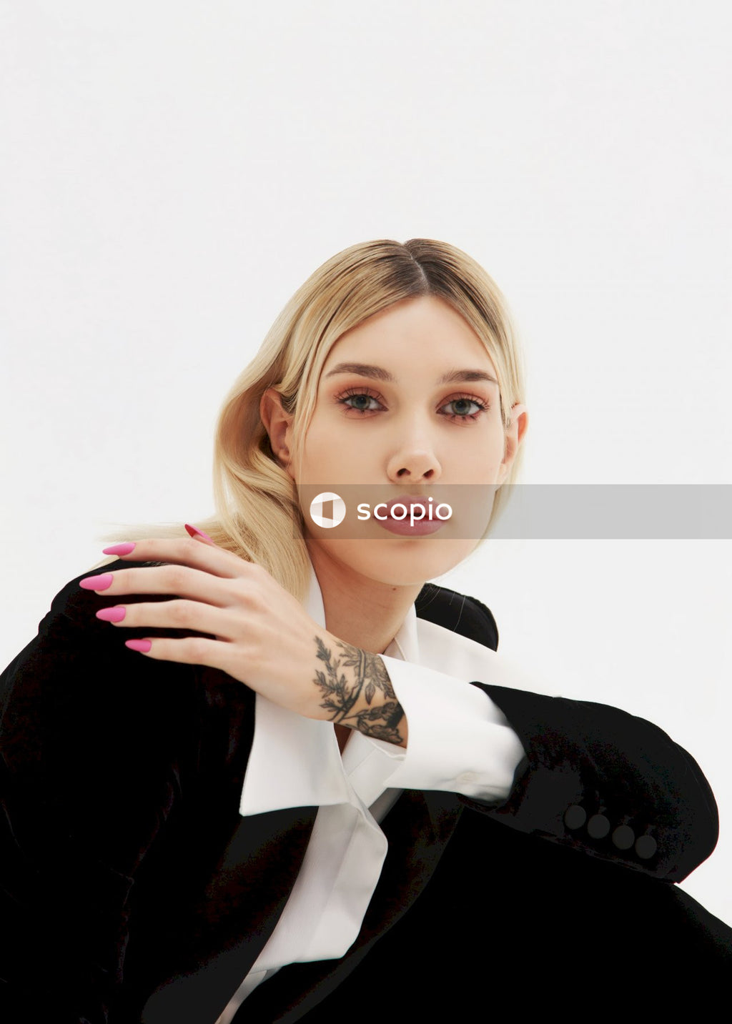 Woman in black blazer with white background