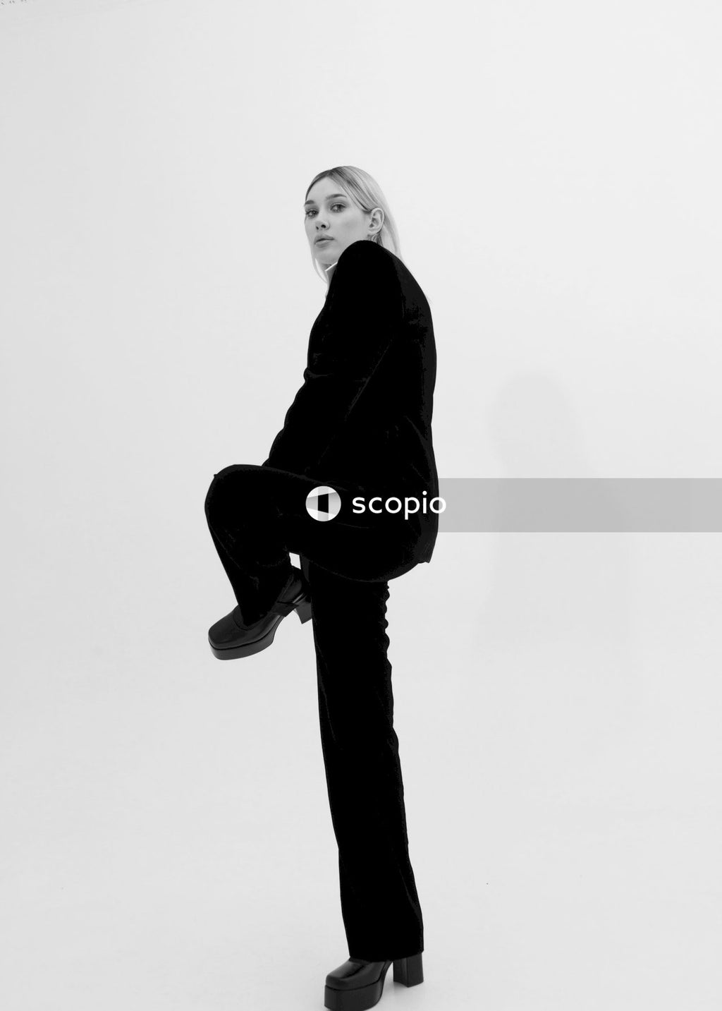 Woman in black coat and pants