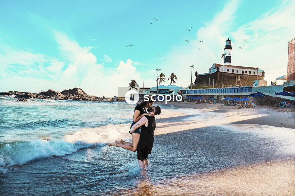 Man holding and kissing woman at the beach