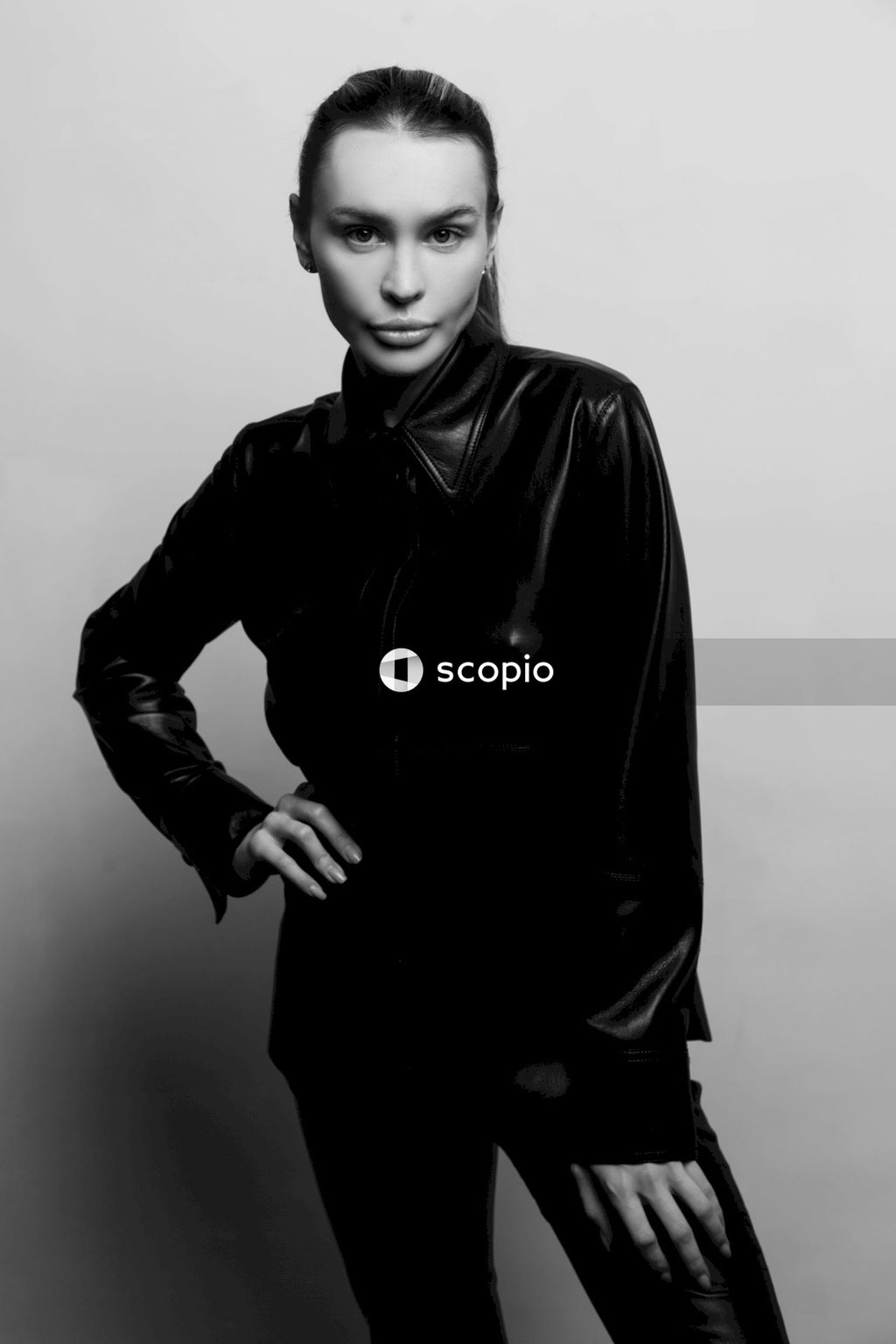 Woman in black leather jacket