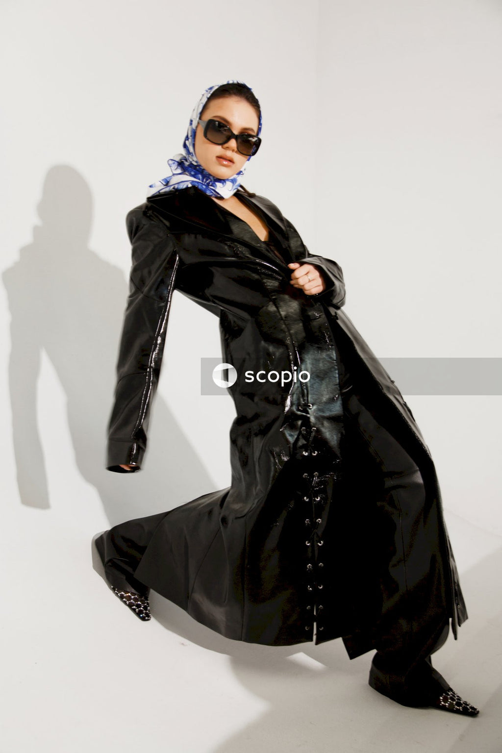 Woman in black leather jacket and blue hijab