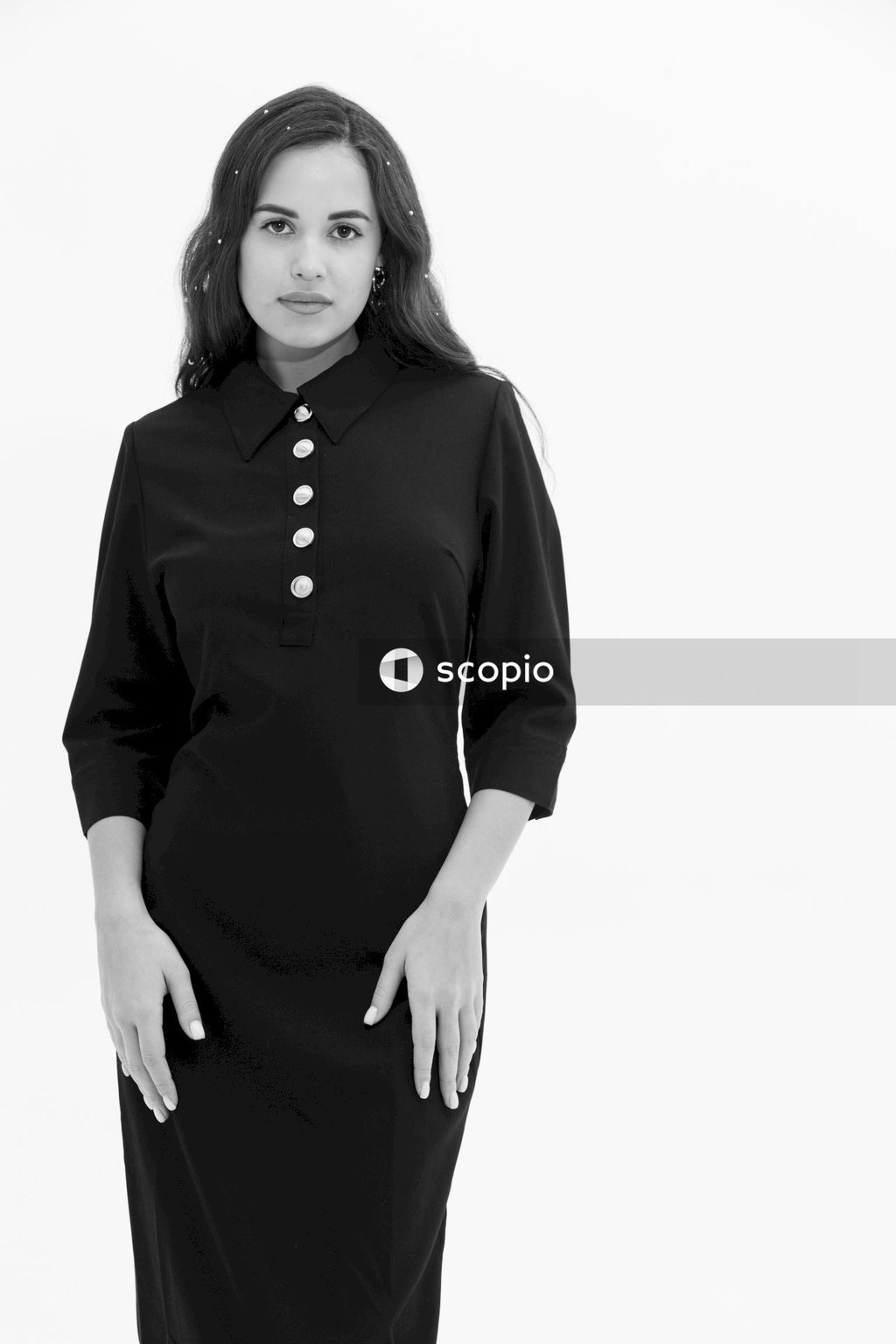 Woman in black long sleeve dress