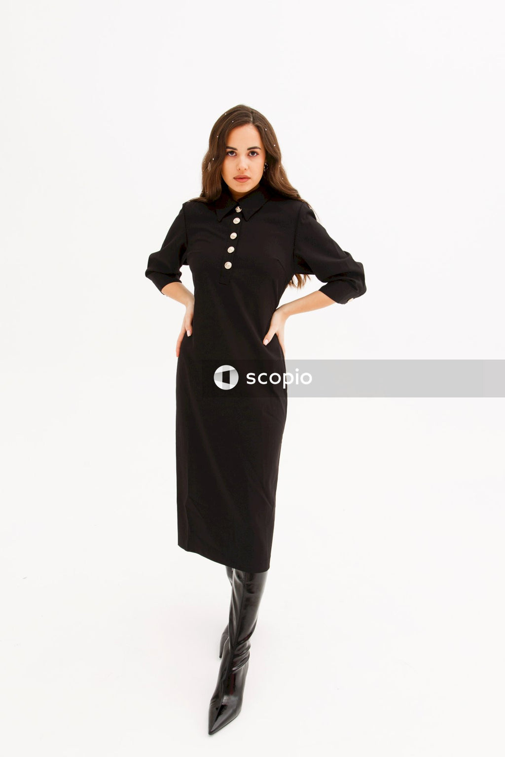 Woman in black long sleeve dress