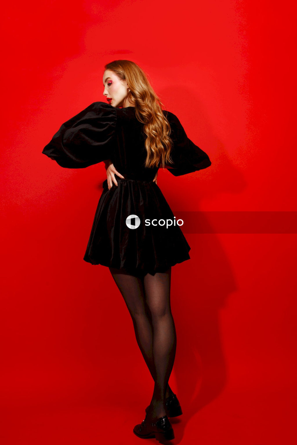Woman in black long sleeve dress