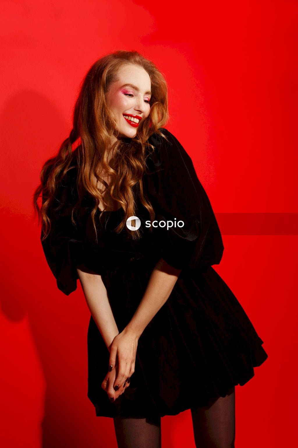Woman in black long sleeve dress