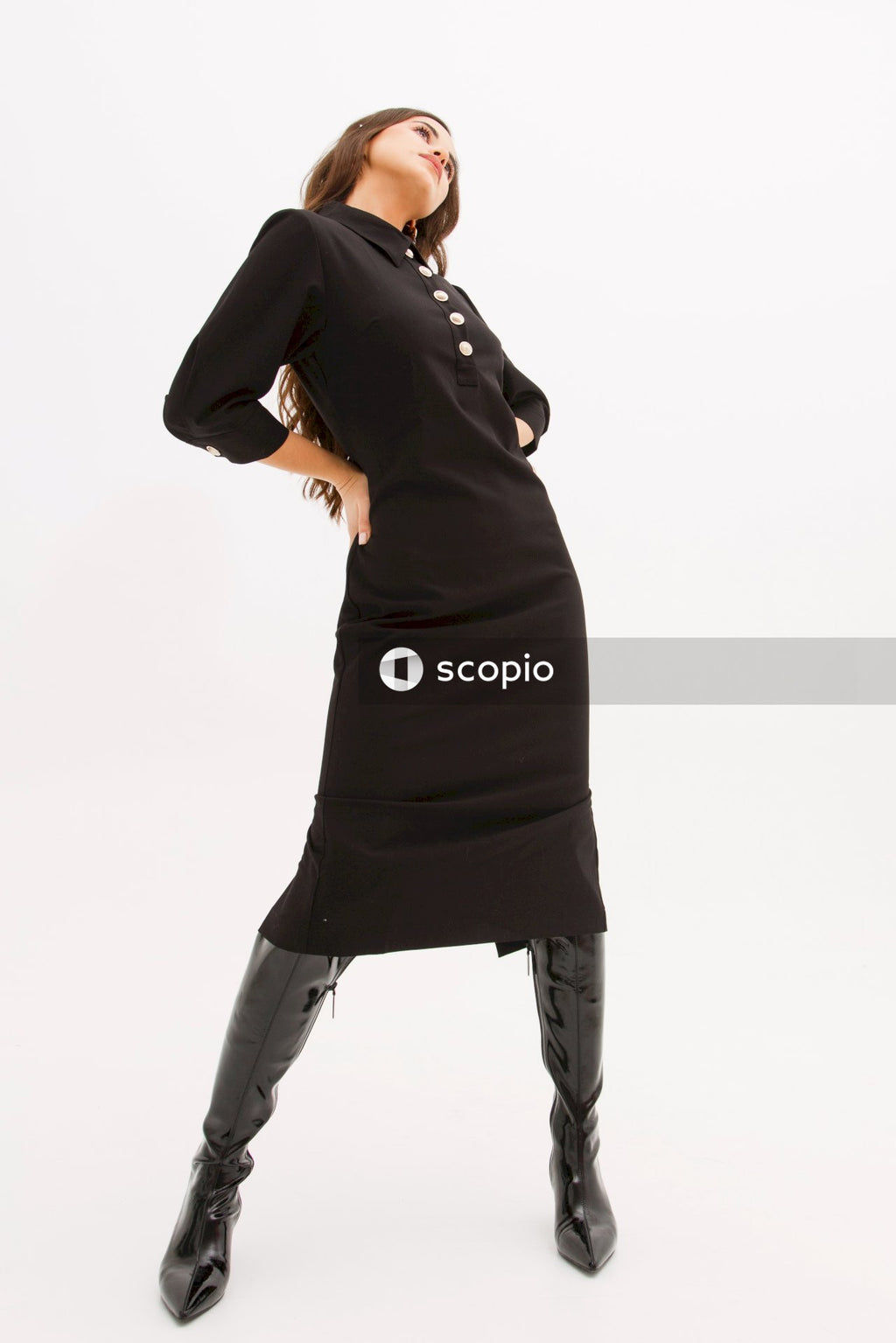 Woman in black long sleeve shirt and black pants