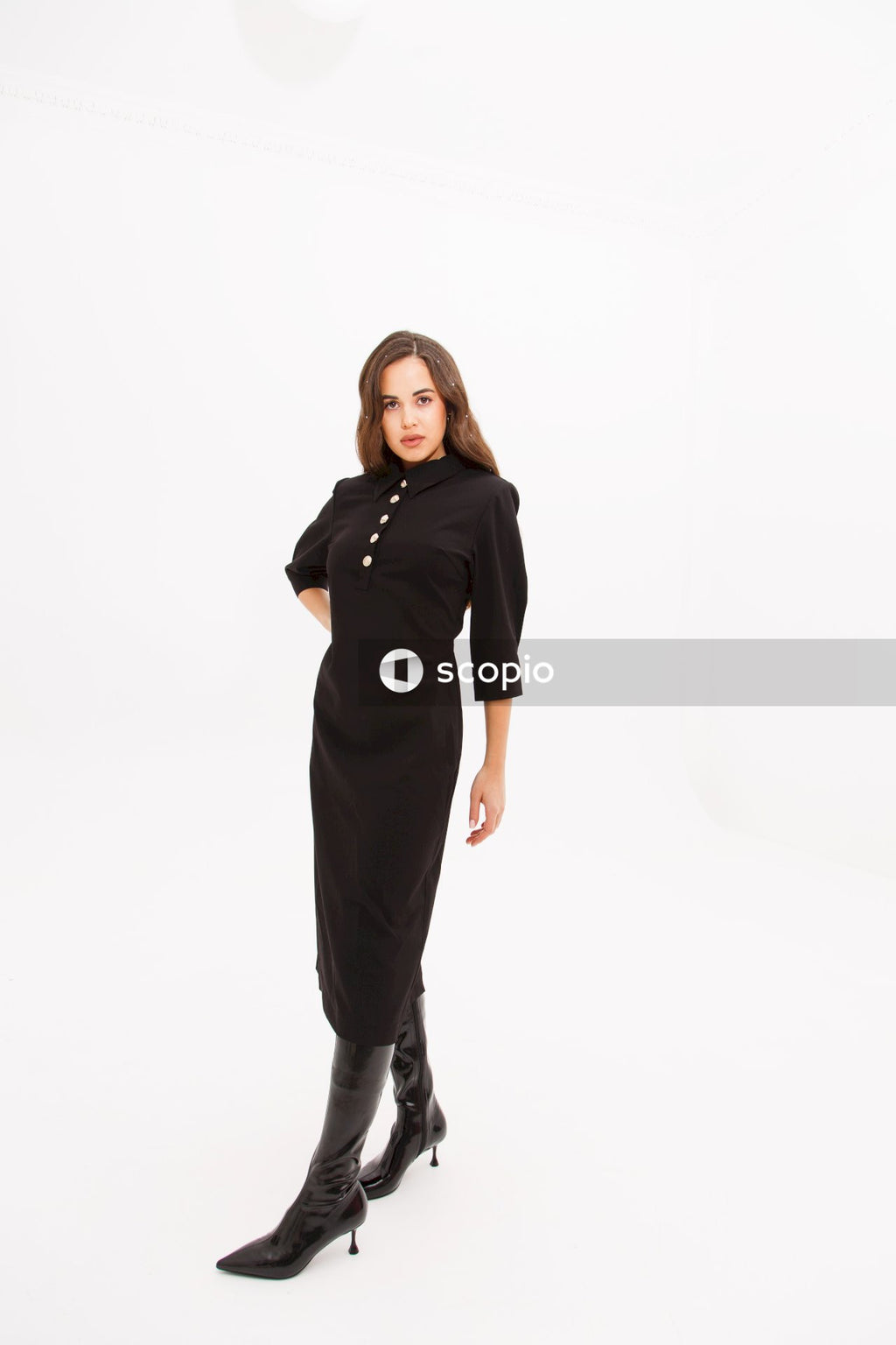 Woman in black long sleeve shirt and black pants